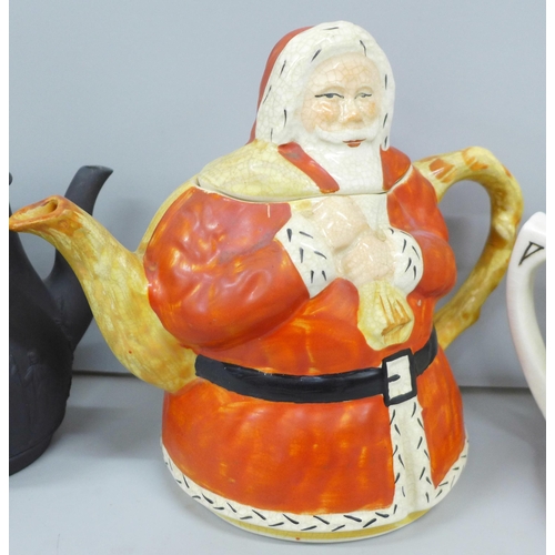 2085 - Four tea pots; musical teapot, O Dear Augustin melody, 'Wild Flowers' teapot, ‘Lucky Santa Claus' te... 