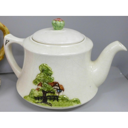 2085 - Four tea pots; musical teapot, O Dear Augustin melody, 'Wild Flowers' teapot, ‘Lucky Santa Claus' te... 