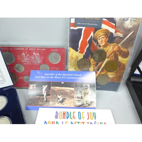 2102 - Coins; four Royal Mint sets, First World War Circulating Coinage Set, Second World War Coinage and M... 