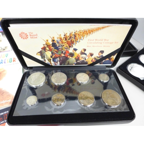 2102 - Coins; four Royal Mint sets, First World War Circulating Coinage Set, Second World War Coinage and M... 