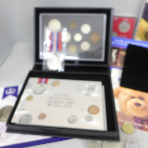 2102 - Coins; four Royal Mint sets, First World War Circulating Coinage Set, Second World War Coinage and M... 