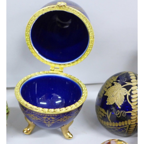 2109 - A collection of decorative egg ornaments and trinket boxes including cloisonné and Russian made