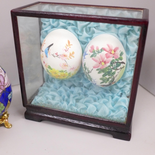 2109 - A collection of decorative egg ornaments and trinket boxes including cloisonné and Russian made