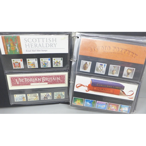 2115 - Stamps; an album of Great Britain presentation packs, (48)