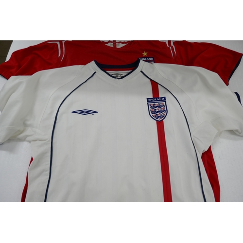 2129 - An England National Football Team 2002-2004 home shirt, size medium and a 2004-2006 away shirt