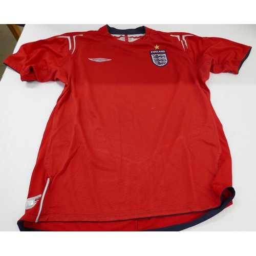 2129 - An England National Football Team 2002-2004 home shirt, size medium and a 2004-2006 away shirt