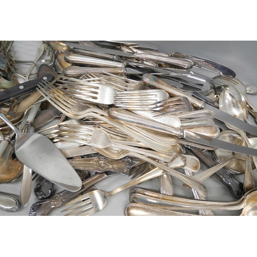 2133 - A collection of silver plated cutlery, other flatware and a toastrack