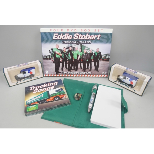 2140 - Four Eddie Stobart porcelain decorative plates, a DVD box set, two trams and a Scania low loader