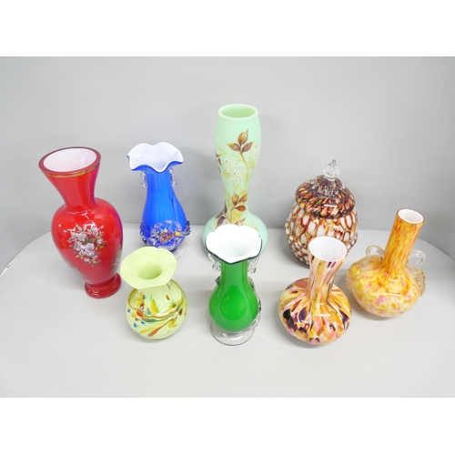 2214 - Eight coloured glass vases with various designs, to include mottled decoration, and blown glass exam... 