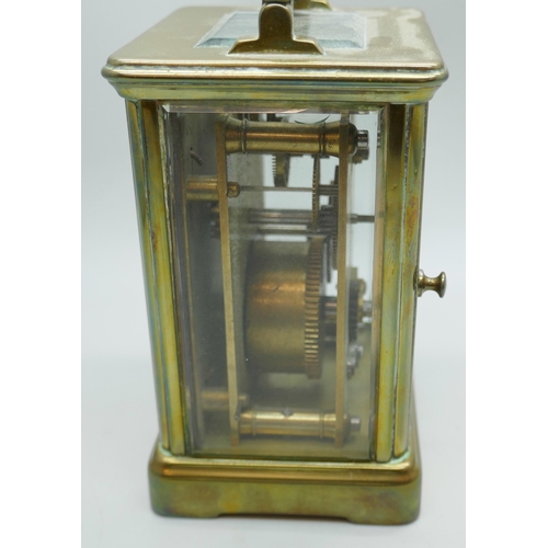 2239 - A small brass four glass sided carriage clock, 11cm tall