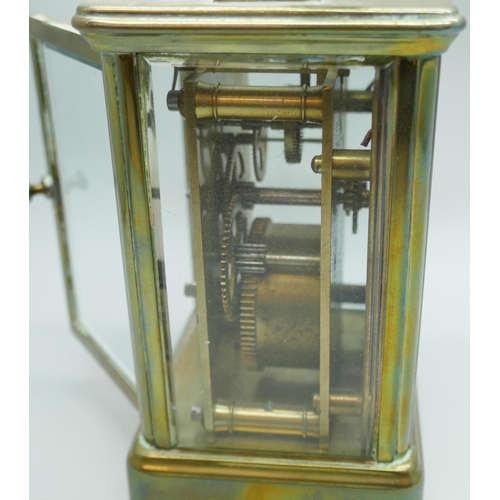 2239 - A small brass four glass sided carriage clock, 11cm tall