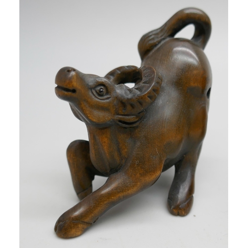 2256 - A collection of three carved boxwood netsuke figures, elephants