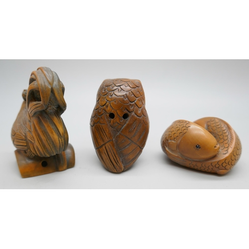 2257 - A collection of three carved boxwood netsuke figures, fish, owl and chicken