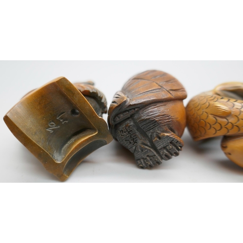 2257 - A collection of three carved boxwood netsuke figures, fish, owl and chicken