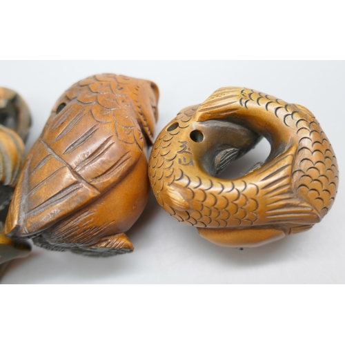 2257 - A collection of three carved boxwood netsuke figures, fish, owl and chicken