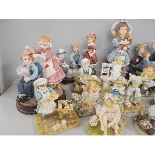 2300 - A collection of seventeen Juliana collection figures including five larger examples on wooden bases,... 