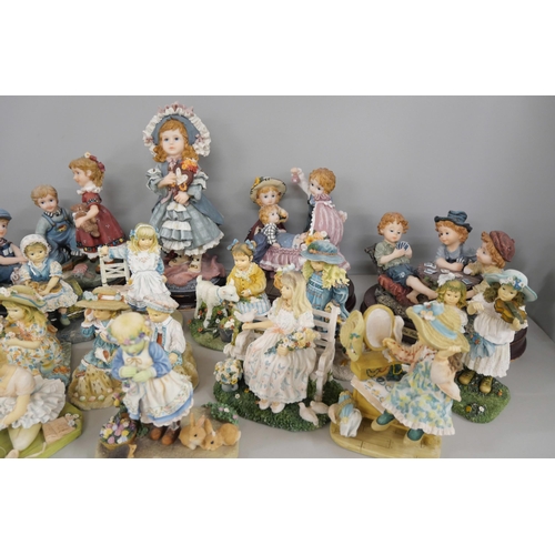 2300 - A collection of seventeen Juliana collection figures including five larger examples on wooden bases,... 