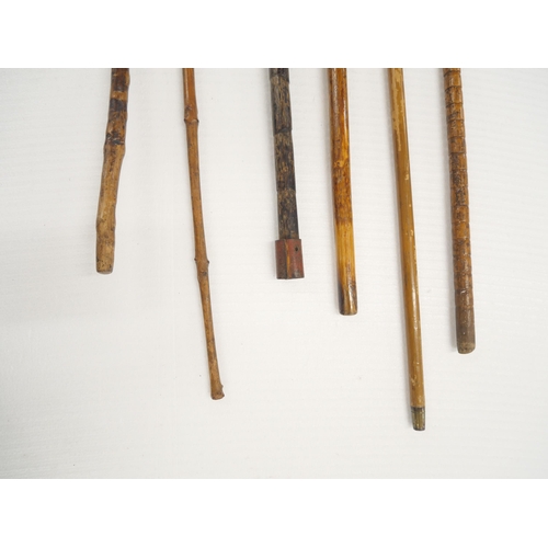 2324 - Six walking sticks/canes with silver embellishments, one with collar loose and a/f