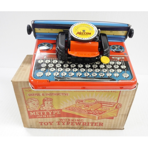 2343 - A Tri-ang Toys garage, boxed, Mettype typewriter, with box and a Codeg cash register