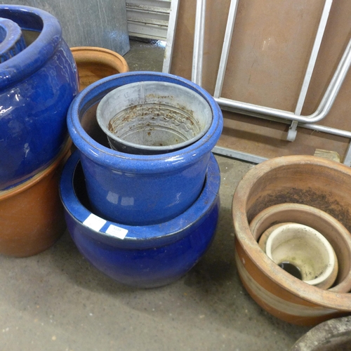 5159 - A collection of various terracotta/blue plant pots