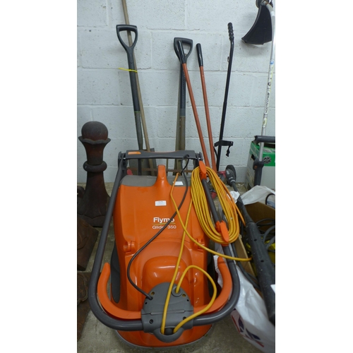 5176 - A Flymo Glider 350 lawnmower and a quantity of assorted tools including Pick-axe, spade, fork, brush... 