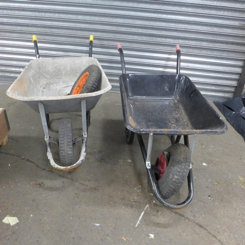 5205 - Two heavy duty metal wheelbarrows with a replacement wheel