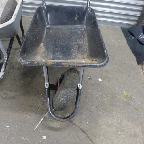 5205 - Two heavy duty metal wheelbarrows with a replacement wheel