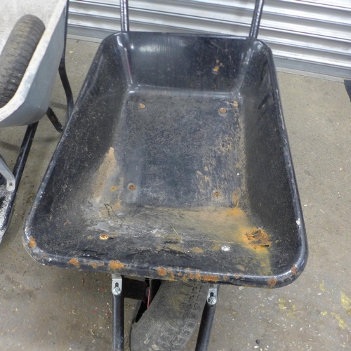 5205 - Two heavy duty metal wheelbarrows with a replacement wheel