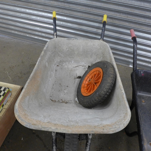 5205 - Two heavy duty metal wheelbarrows with a replacement wheel