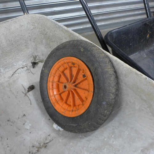 5205 - Two heavy duty metal wheelbarrows with a replacement wheel