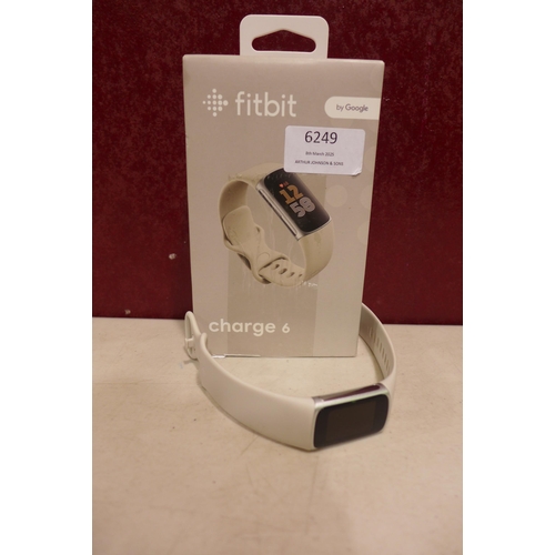 6249 - Fitbit Charge 6 activity tracker with beige wristband *This lot is subject to VAT