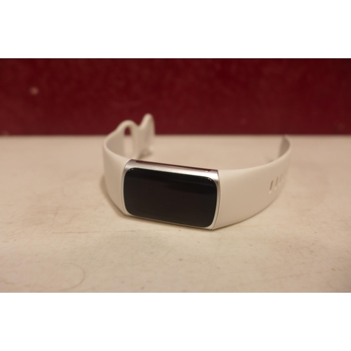 6249 - Fitbit Charge 6 activity tracker with beige wristband *This lot is subject to VAT