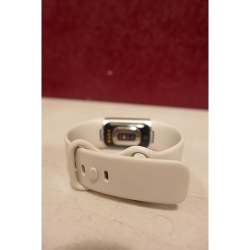 6249 - Fitbit Charge 6 activity tracker with beige wristband *This lot is subject to VAT