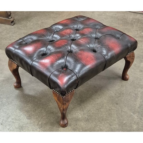 5 - An oxblood red leather Chesterfield footstool