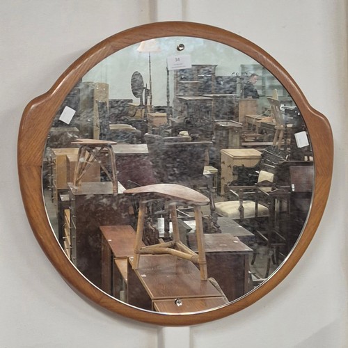 34 - A Danish teak framed circular mirror