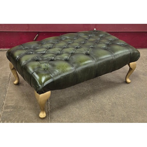 6 - A green leather Chesterfield footstool