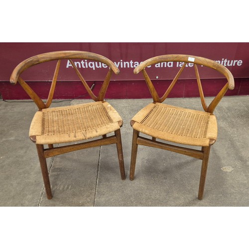 21 - A pair of Danish Bruno Hansen teak and paper cord seated 255 model wishbone chairs, designed by Henn... 