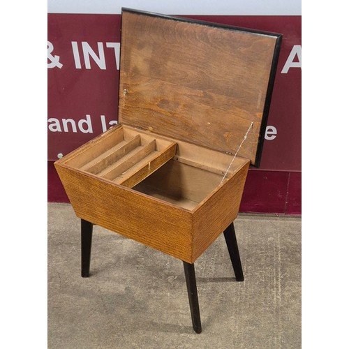 33 - An oak and black legged lady's sewing box