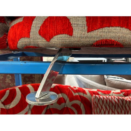 3067 - A red and grey patterned three seater sofa