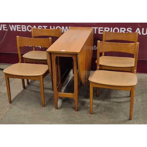 51 - A teak drop leaf table and four chairs