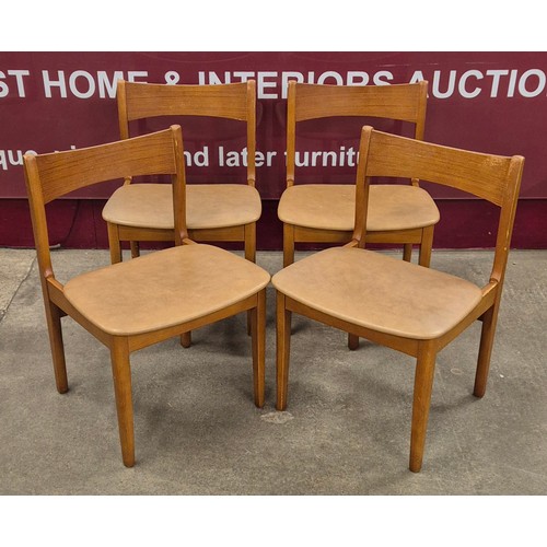 51 - A teak drop leaf table and four chairs