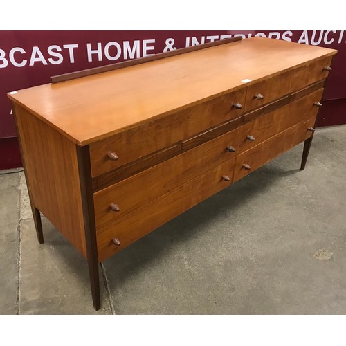 70 - A teak six drawer sideboard