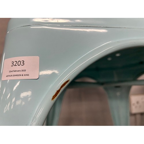 3202 - A set of four baby blue metal dining chairs