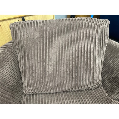 3203 - A brown jumbo cord swivel armchair