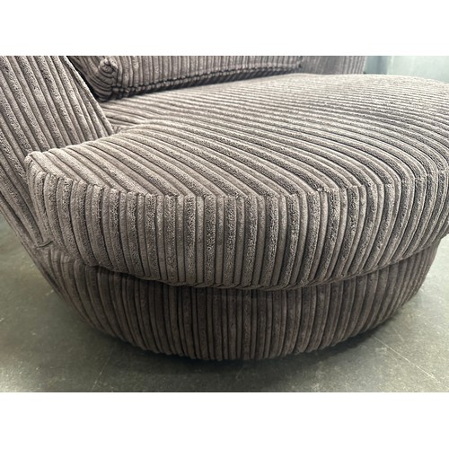 3203 - A brown jumbo cord swivel armchair