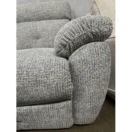3231 - A white and blue woven two seater sofa