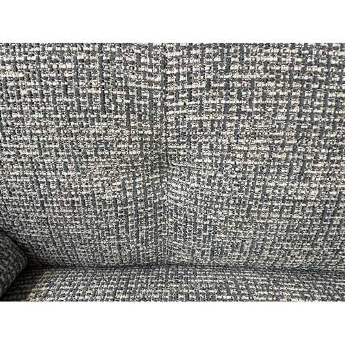 3231 - A white and blue woven two seater sofa