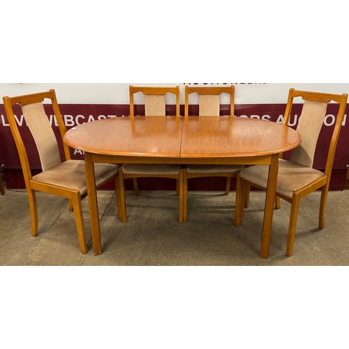 62 - A teak extending dining table and four chairs