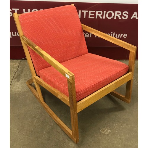 64 - A Danish style light oak rocking chair