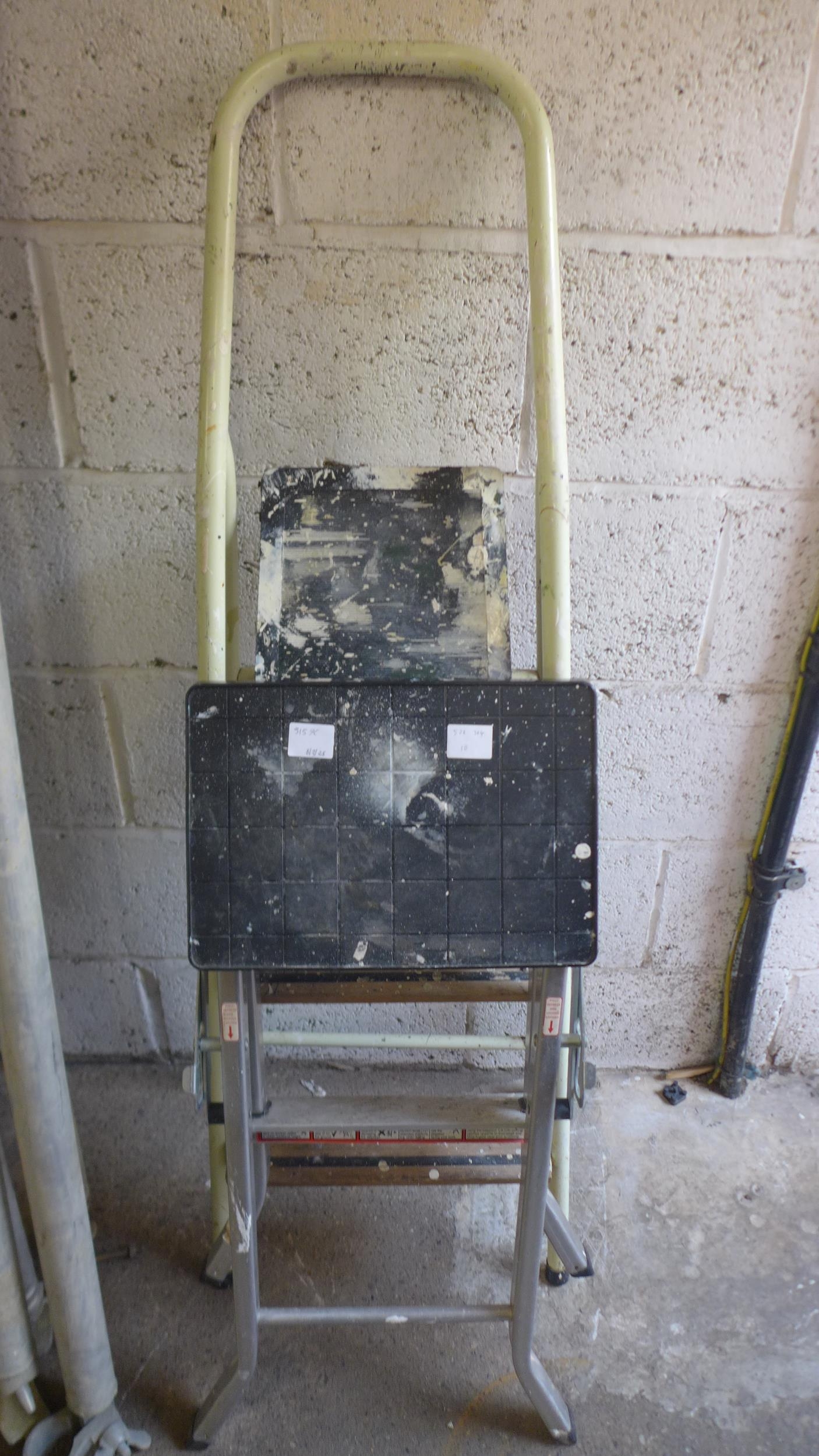 Two sets of step ladders, both 3 rung